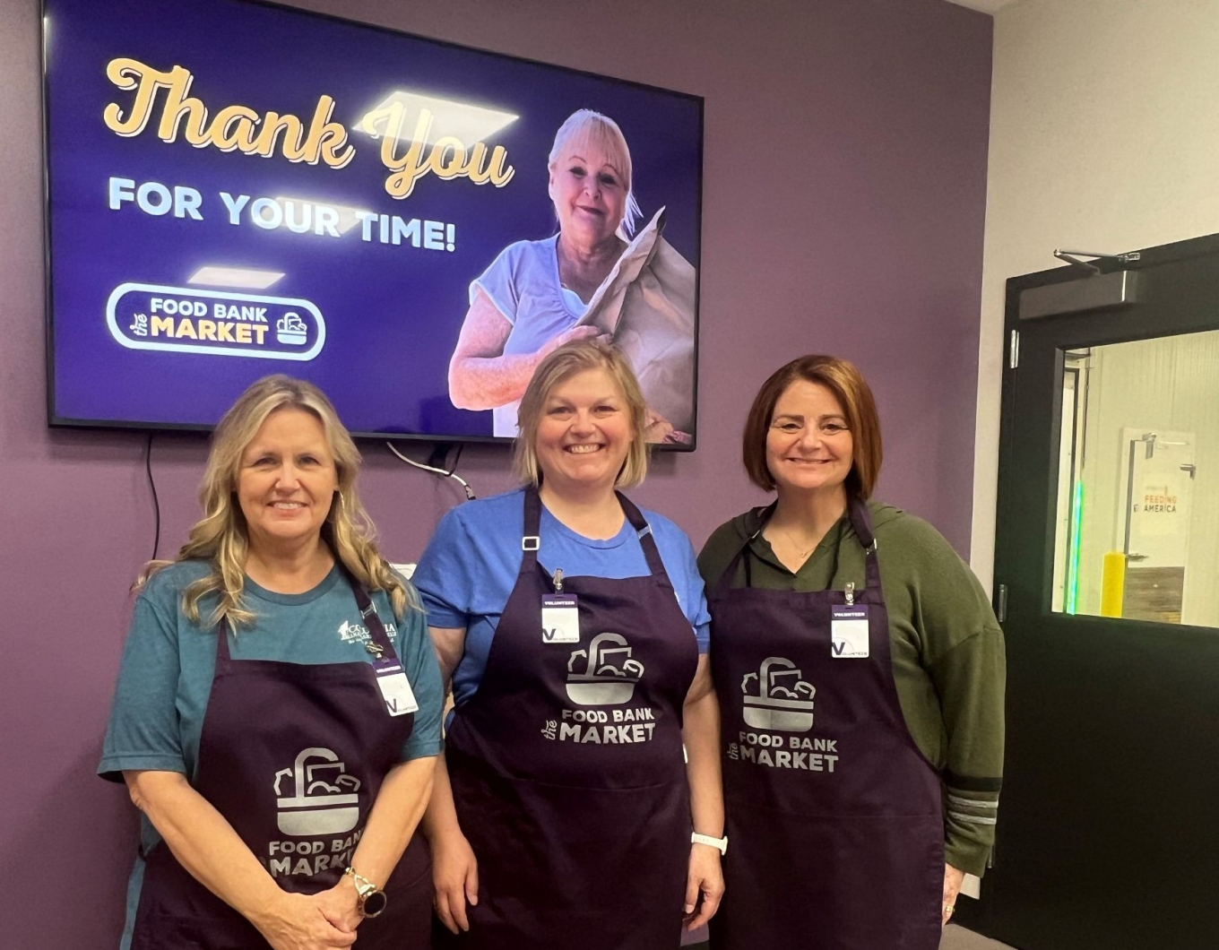 Colleagues volunteer at the Food Bank Market.