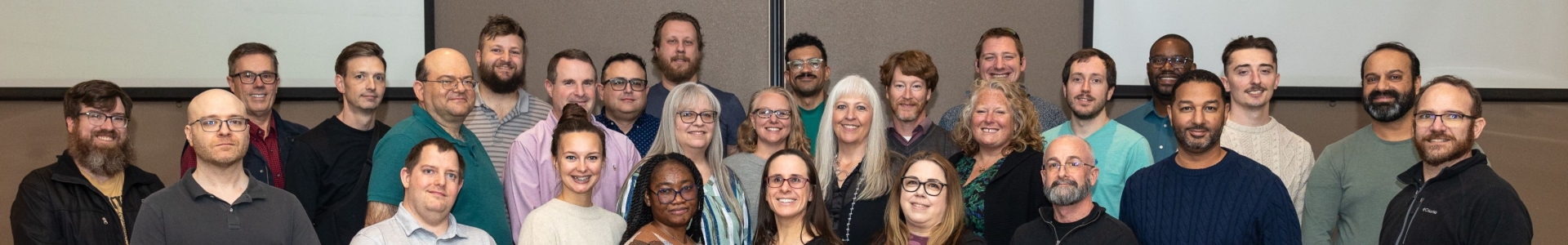 Many members of the Columbia Insurance IT team pose for a group photo.