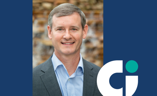 Photo of Matthew Burnett along with a blue background and the Columbia logo.