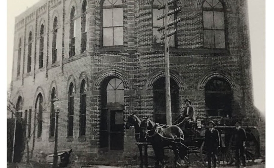 Side by side photo of the USI-Oklahoma building--one from when it was built in 1906, and one from 2023.