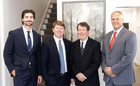 Greenhalgh Insurance Agency’s commercial lines producers Garrett Brasher, left, Adam Greenhalgh, Russell Greenhalgh and Walter Crye.